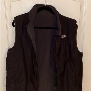Black and grey north face reversible vest.